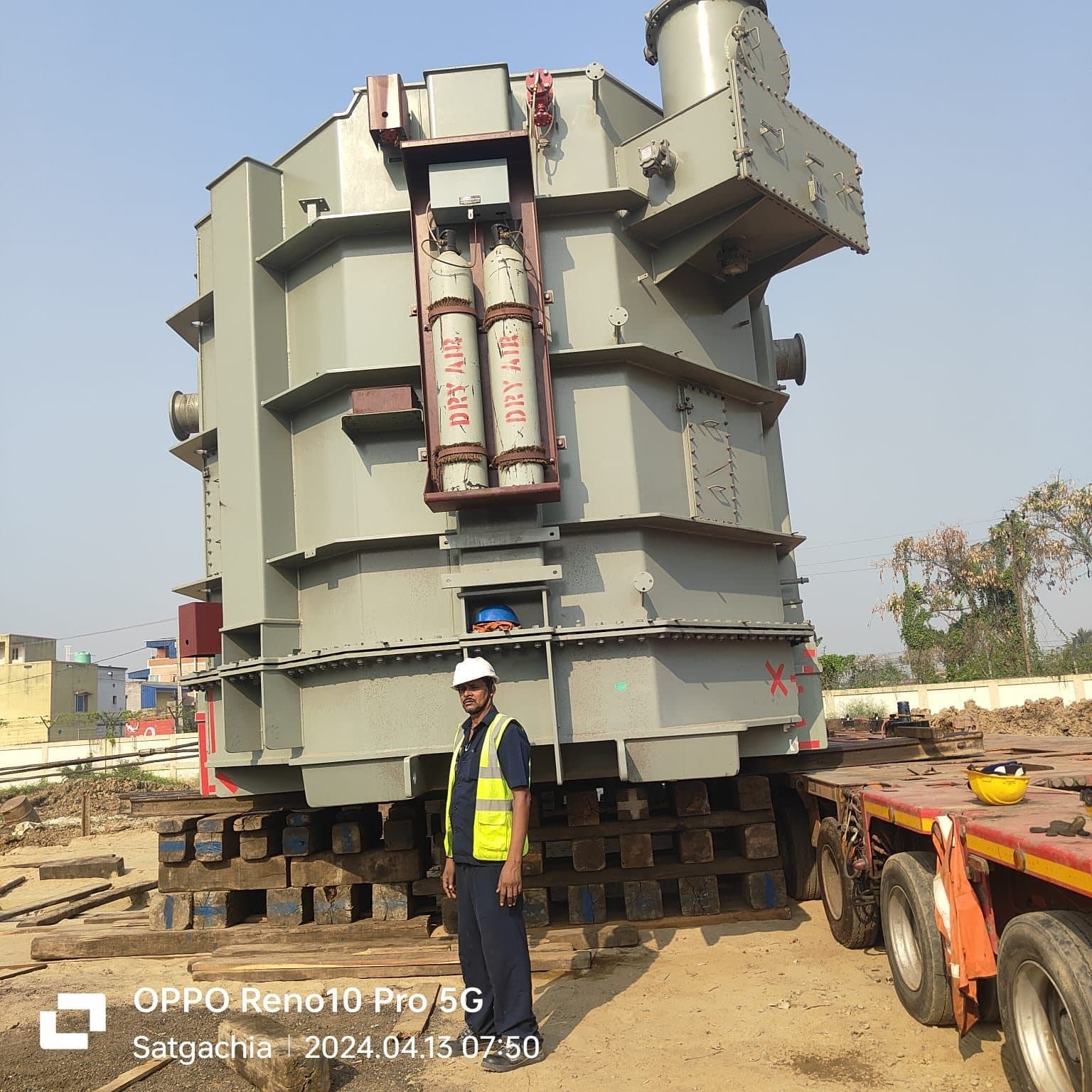 510 MVA power transformer standing on hydraulic jack stands beside a multi-axle trailer at Satgachi sub-station, Burdwan, with an IPN LIFTERS rigger alongside